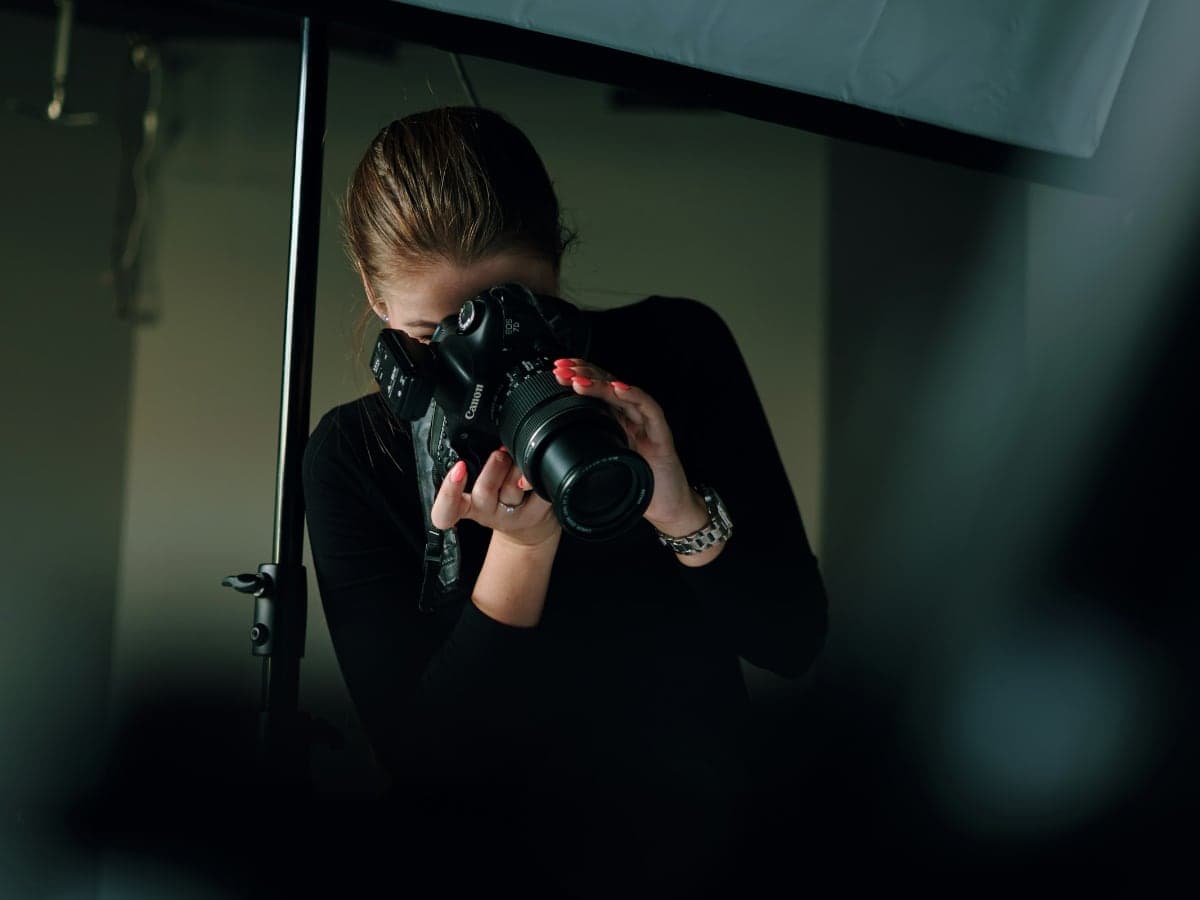 A photographer shooting on set